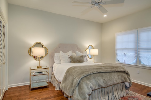 bedroom with baseboards, wood finished floors, and recessed lighting