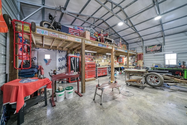 garage with metal wall and a workshop area