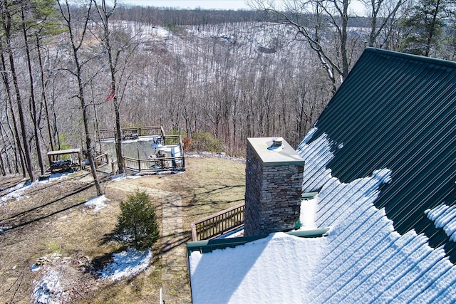 exterior space with a forest view