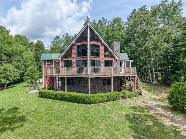 101 Dakota Ln, Spencer, TN 38585 - back of property with stairs, a deck, a chimney, and a lawn