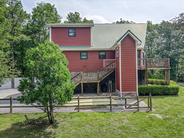 101 Dakota Ln, Spencer, TN 38585 - back of house with stairs, a deck, stone siding, and a metal roof