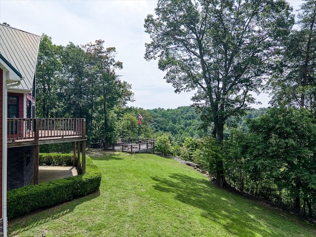 101 Dakota Ln, Spencer, TN 38585 - view of green lawn featuring a wooden deck and a view of trees