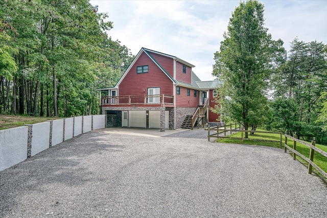 101 Dakota Ln, Spencer, TN 38585 - chalet / cabin featuring stairs, a garage, driveway, and stone siding