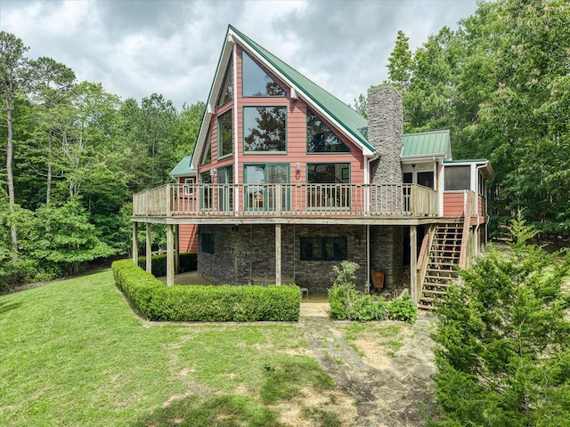 101 Dakota Ln, Spencer, TN 38585 - rear view of property with a deck, stairway, a yard, and a chimney