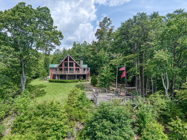 101 Dakota Ln, Spencer, TN 38585 - rear view of property with a wooden deck, a lawn, and a forest view