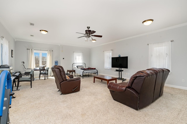 carpeted living room with crown molding, ceiling fan, visible vents, and baseboards