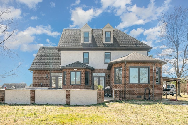 view of front facade featuring french doors, brick siding, stucco siding, a shingled roof, and crawl space