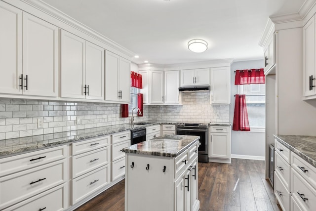 kitchen with stainless steel electric range oven, dark stone counters, white cabinets, and dishwasher