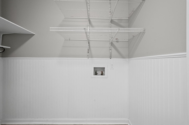 laundry room featuring washer hookup, laundry area, and wainscoting