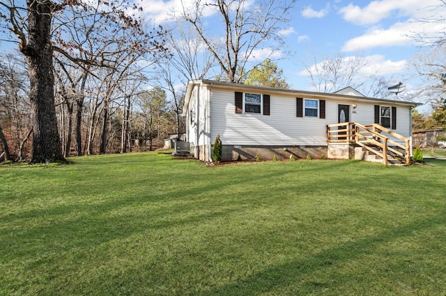 view of front facade featuring crawl space, a front lawn, and central air condition unit