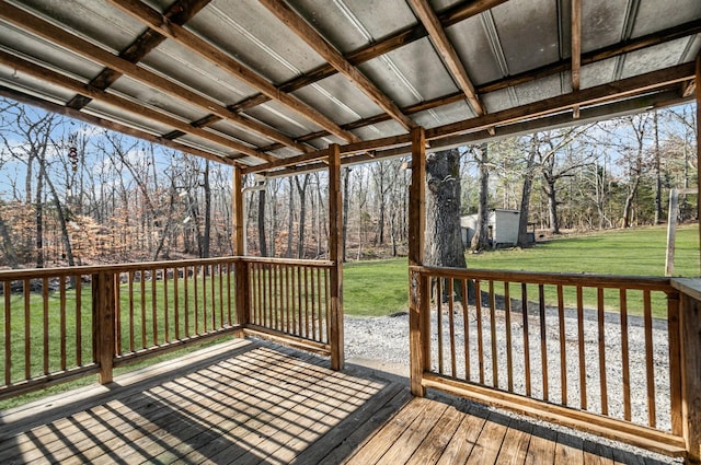 wooden deck featuring a yard