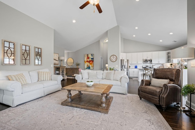 living room featuring high vaulted ceiling, recessed lighting, ceiling fan, and wood finished floors