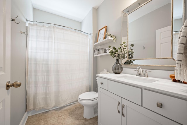 full bath with curtained shower, vanity, and toilet