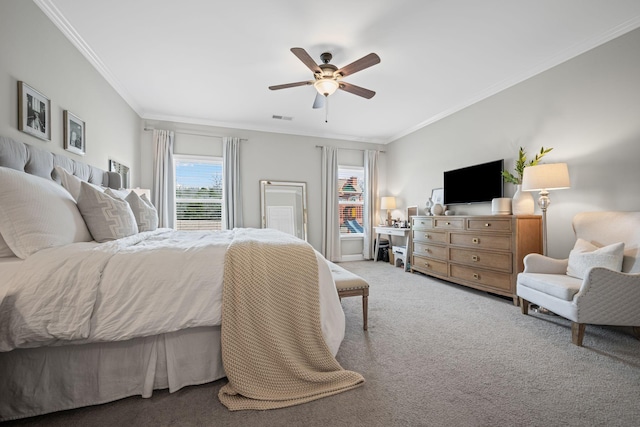 carpeted bedroom featuring visible vents, a ceiling fan, and ornamental molding