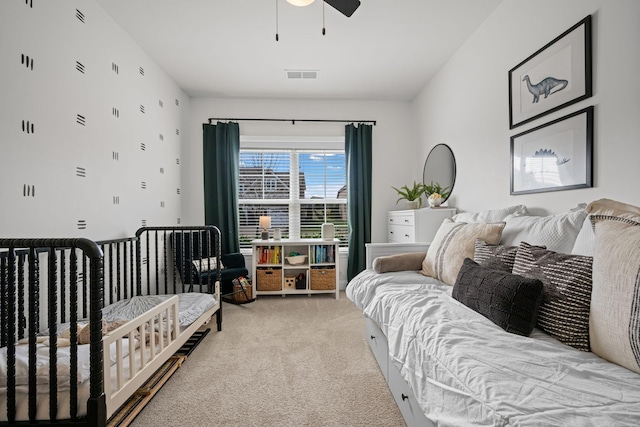 bedroom featuring carpet flooring, visible vents, and a ceiling fan