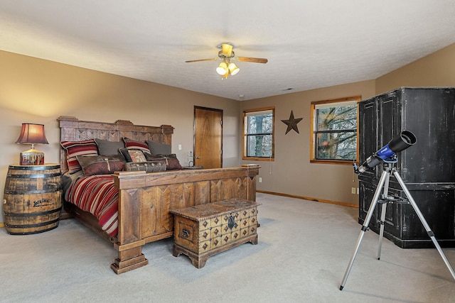 bedroom featuring carpet, ceiling fan, and baseboards