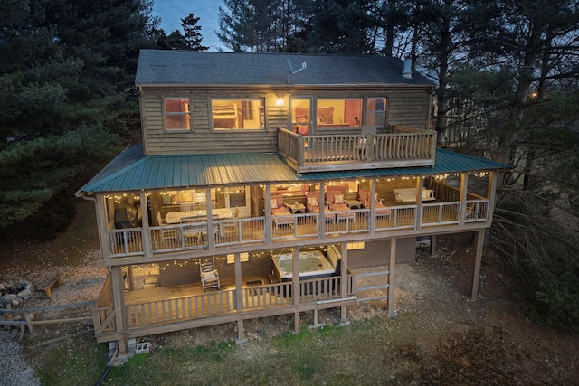 back of property featuring a balcony