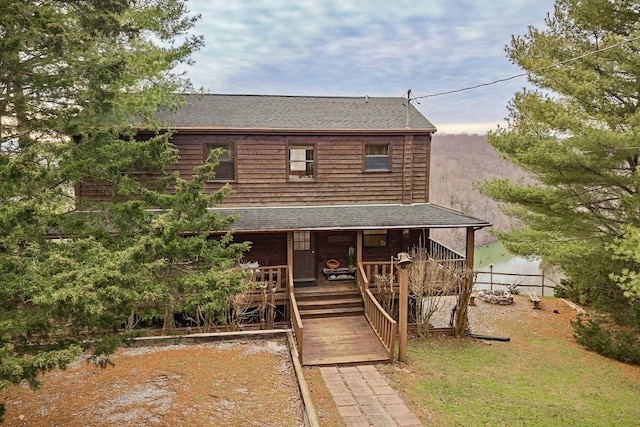 view of front of house featuring a shingled roof