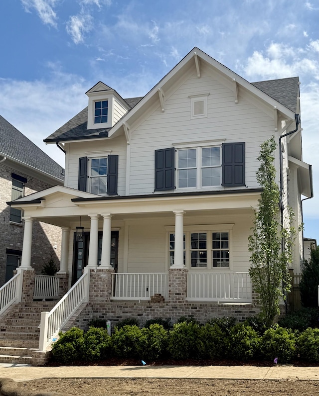 8007 Southvale Blvd, Franklin, TN 37064 - view of front of house featuring a porch, brick siding, and a shingled roof