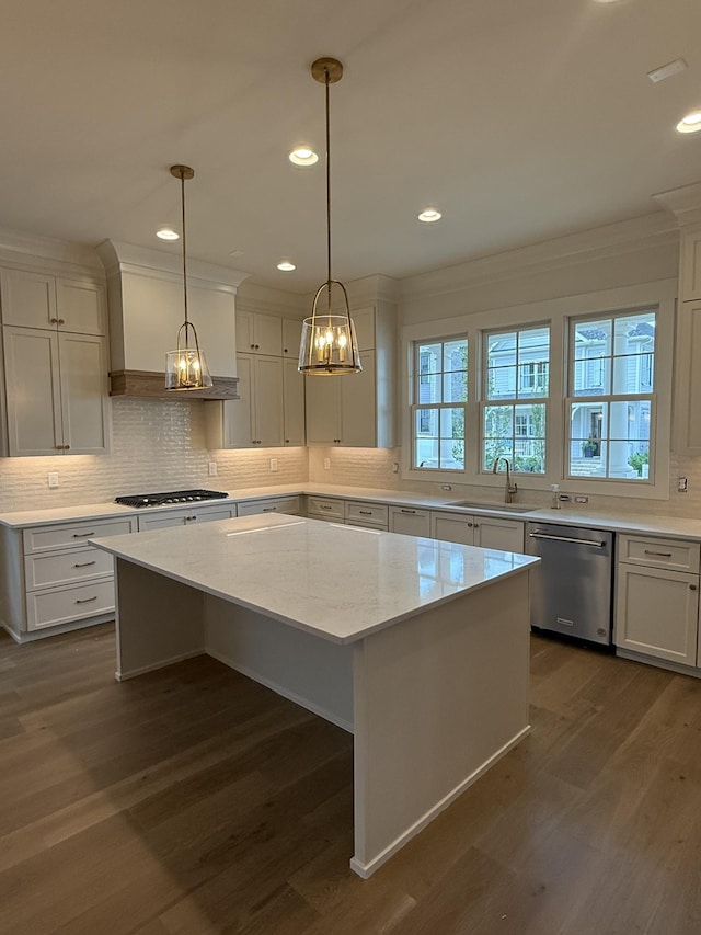 8007 Southvale Blvd, Franklin, TN 37064 - kitchen with appliances with stainless steel finishes, ornamental molding, a center island, decorative backsplash, and dark wood finished floors