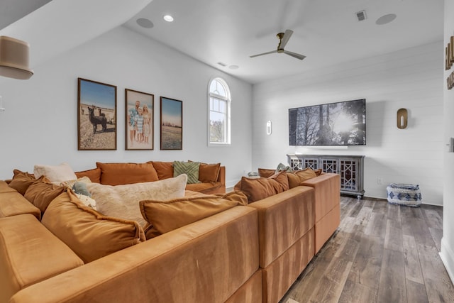 living area featuring ceiling fan, visible vents, dark wood-type flooring, and recessed lighting