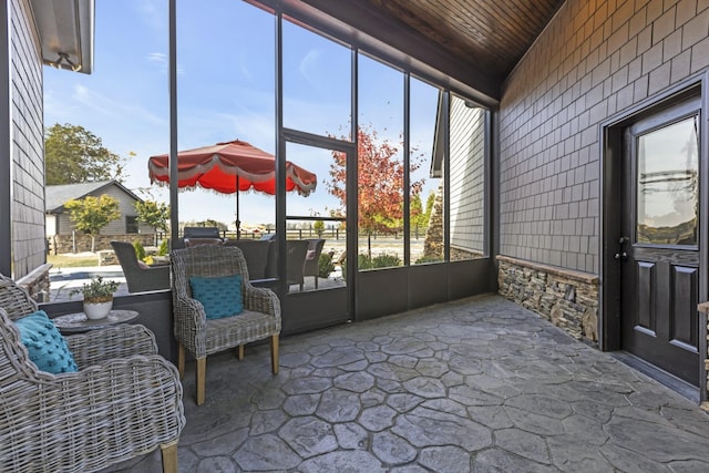 sunroom featuring wooden ceiling