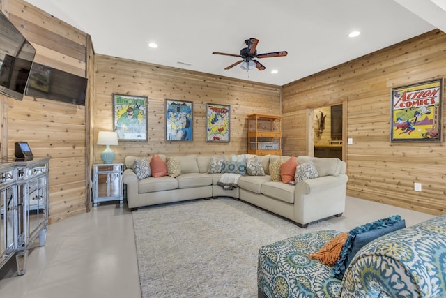 living room with finished concrete floors, recessed lighting, and ceiling fan