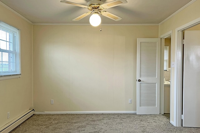 unfurnished room featuring light carpet, a baseboard heating unit, and ornamental molding