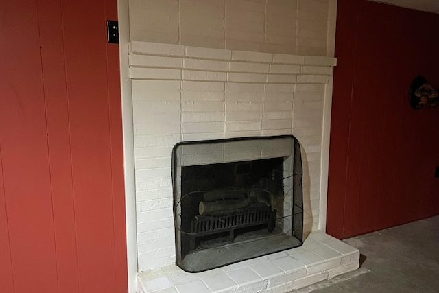 interior details featuring a fireplace with raised hearth