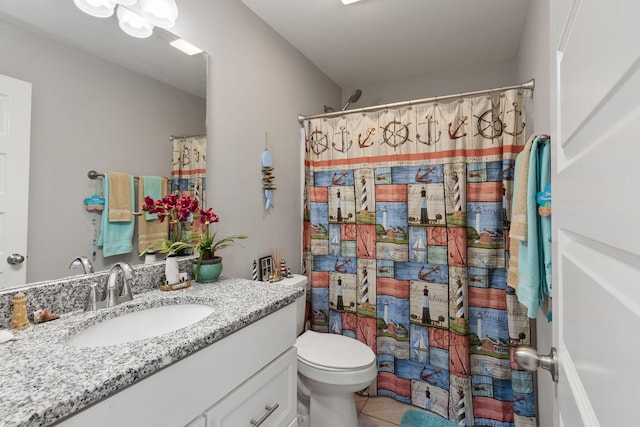 full bath with vanity, tile patterned flooring, and toilet