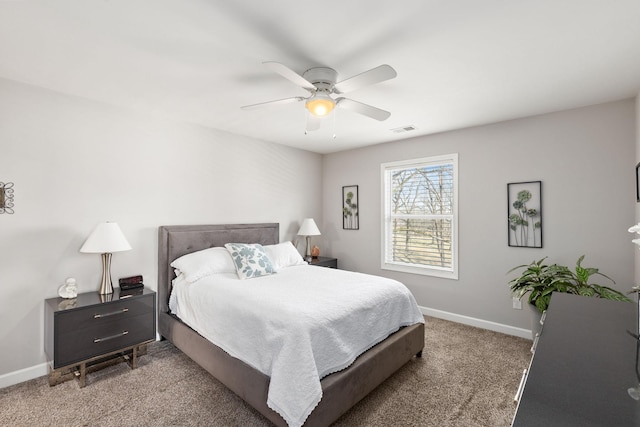 bedroom featuring carpet floors, visible vents, baseboards, and a ceiling fan