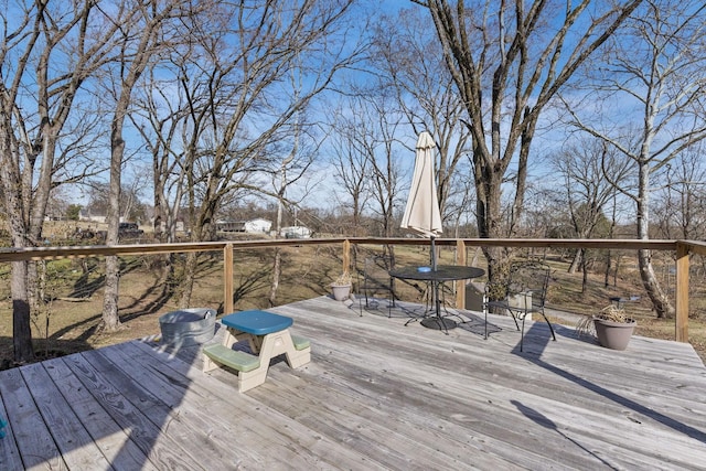 wooden deck with outdoor dining area