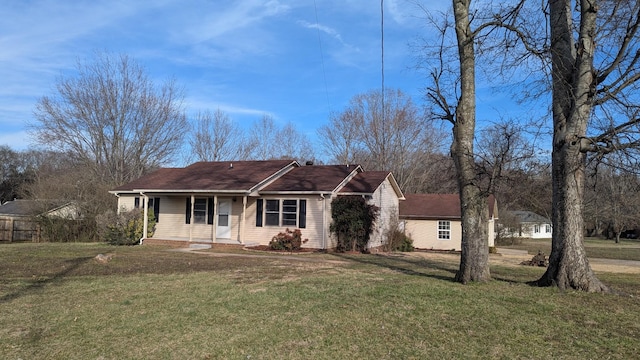 ranch-style house featuring a front lawn