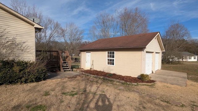 view of outdoor structure with an outbuilding and stairs