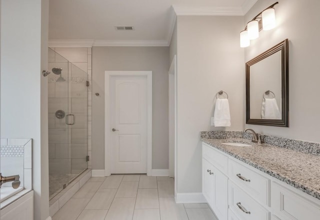 bathroom featuring crown molding, visible vents, a stall shower, vanity, and baseboards