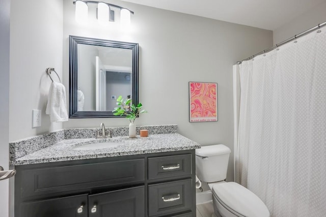 full bathroom with vanity and toilet