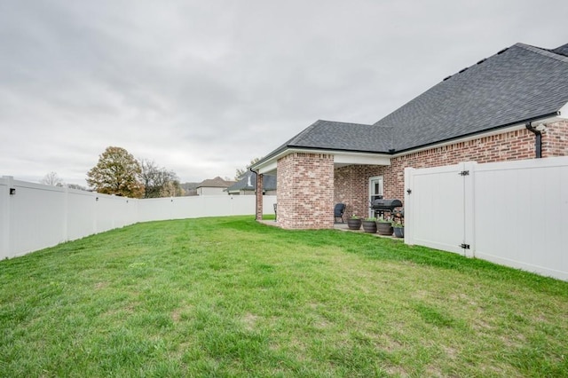 view of yard featuring a fenced backyard