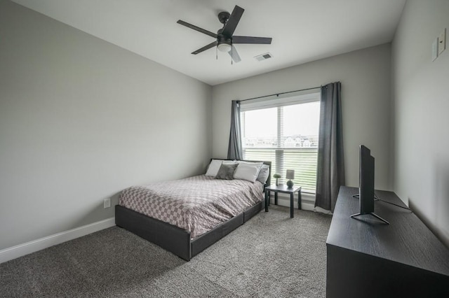 bedroom featuring carpet floors, baseboards, visible vents, and a ceiling fan