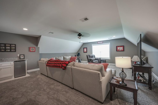 carpeted living room featuring ceiling fan, recessed lighting, visible vents, baseboards, and vaulted ceiling