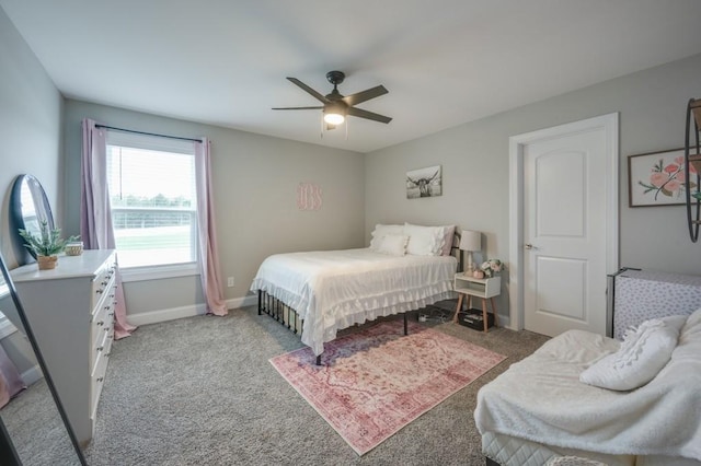 carpeted bedroom featuring ceiling fan and baseboards