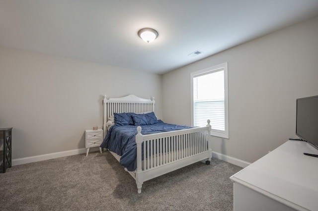 bedroom with baseboards, visible vents, and carpet flooring