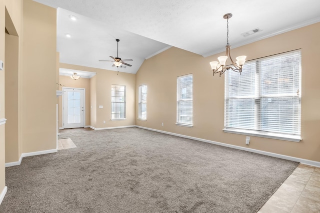 spare room featuring vaulted ceiling, carpet flooring, visible vents, and baseboards