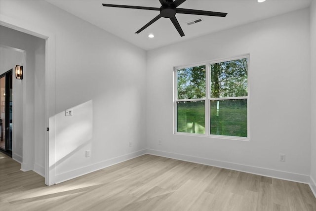 empty room with visible vents, baseboards, a ceiling fan, light wood-style flooring, and recessed lighting