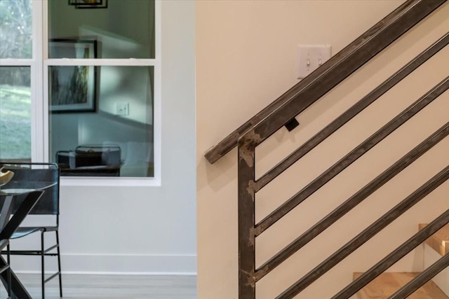 staircase featuring baseboards