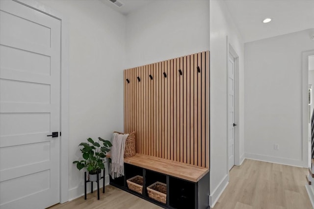 mudroom featuring light wood-style floors, recessed lighting, and baseboards