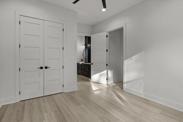 unfurnished bedroom with recessed lighting, a closet, light wood-style floors, a ceiling fan, and baseboards