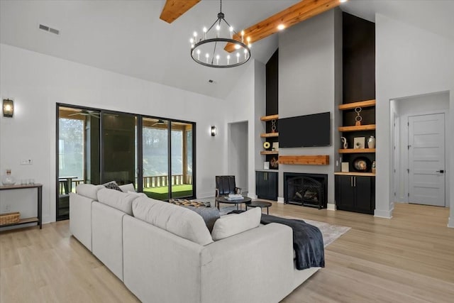 living area featuring light wood-type flooring, high vaulted ceiling, visible vents, and beam ceiling