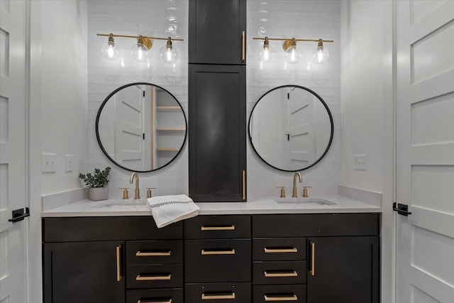 full bathroom with double vanity, backsplash, and a sink