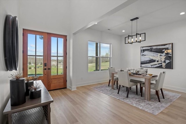 dining space featuring french doors, recessed lighting, light wood-style flooring, and baseboards