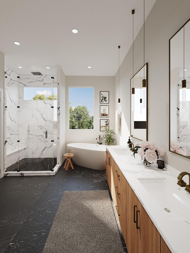 full bath with a sink, a marble finish shower, and a healthy amount of sunlight